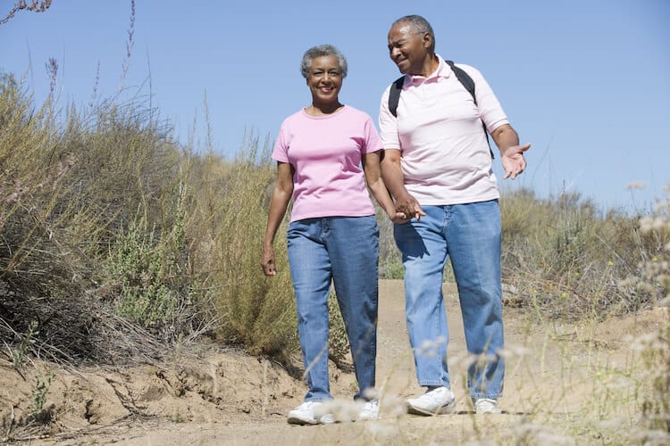 An active senior couple on a hiking trail.