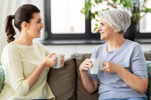 A mother and her adult daughter have a talk.